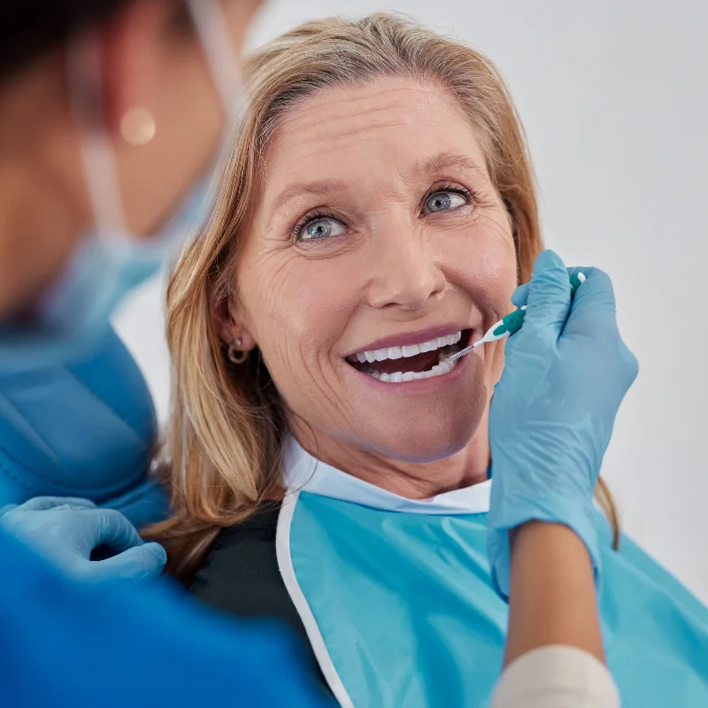 Patient smiling after dental bridge restoration at Riverfront Dental in Cambridge Ontario