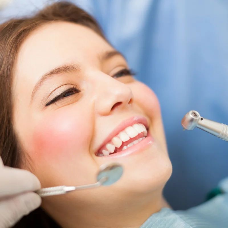 Smiling patient during a dental checkup after wisdom teeth extraction treatment at Riverfront Dental in Cambridge Ontario