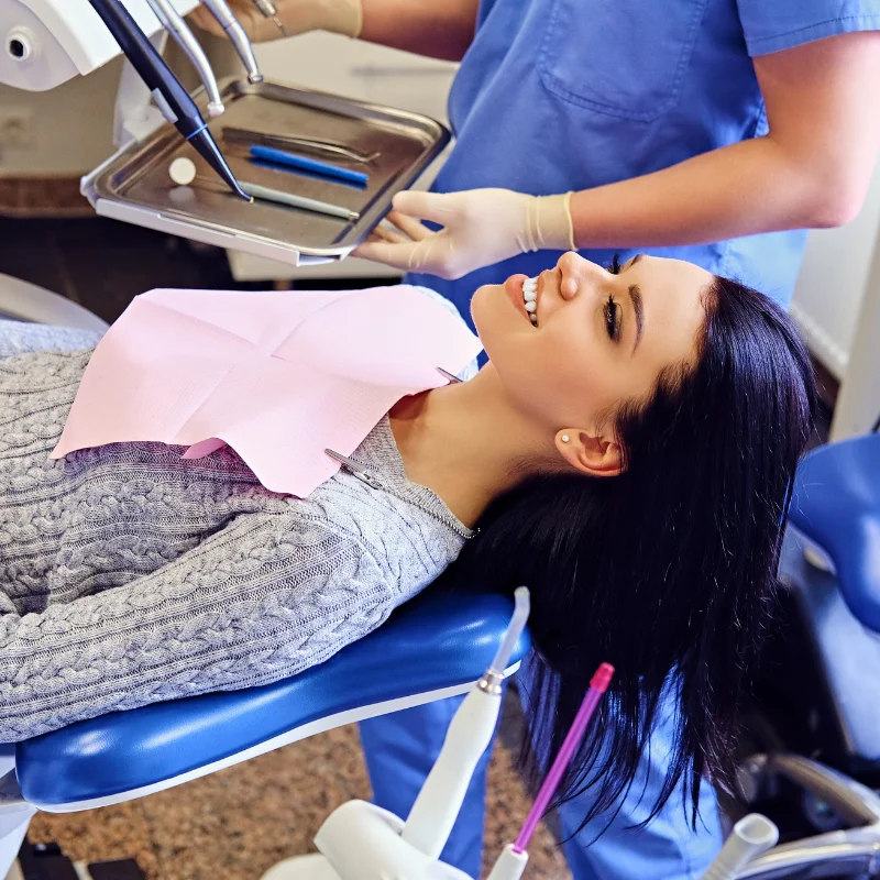 Patient lying in a dental chair preparing for restorative dental treatment at Riverfront Dental in Cambridge Ontario