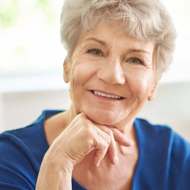 Smiling senior woman representing patients who benefit from denture treatment at Riverfront Dental in Cambridge Ontario