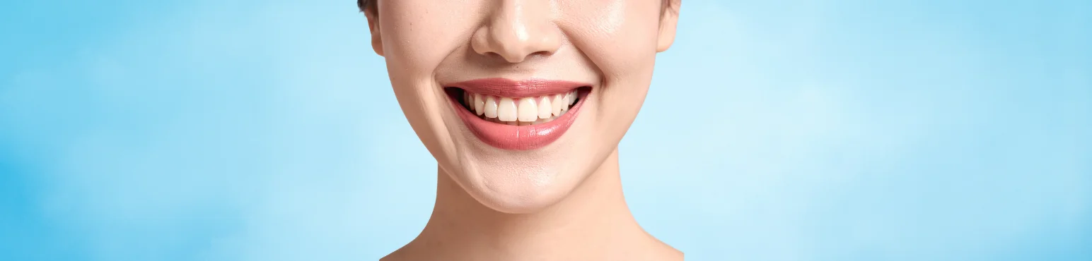 Close up of woman smiling with healthy teeth after oral surgery treatment at Riverfront Dental in Cambridge ON