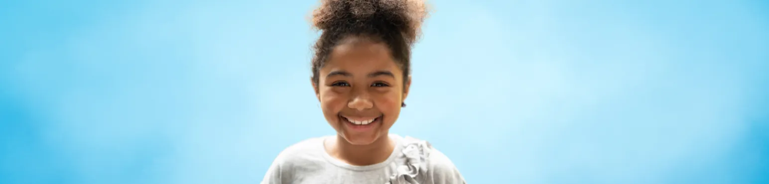 Smiling young girl with healthy teeth representing pediatric dental care at Riverfront Dental in Cambridge ON
